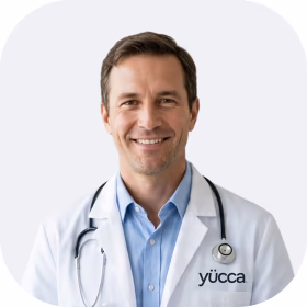 Portrait of a licensed Yucca provider in a white coat with a stethoscope.