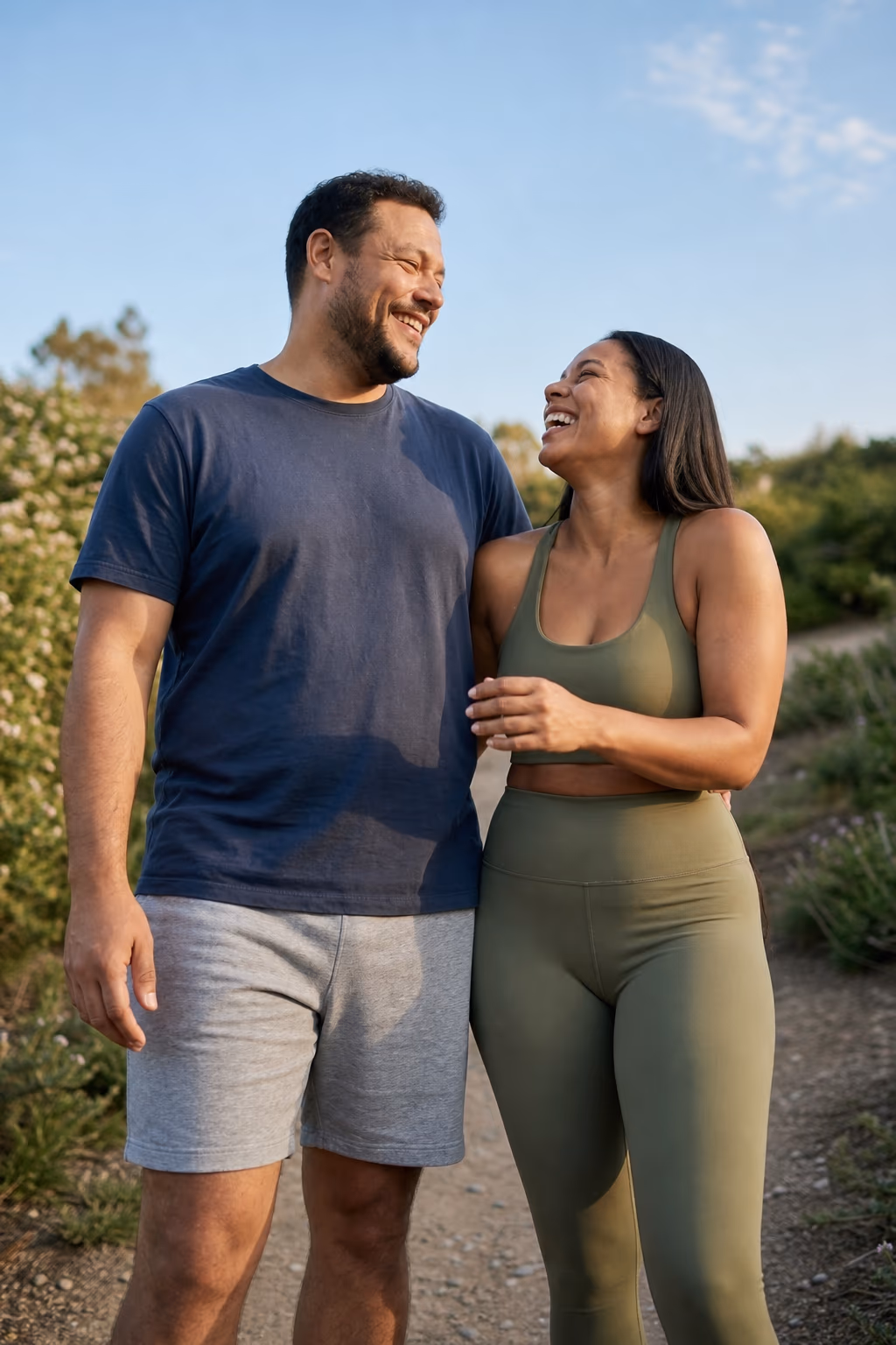 A couple smiling outdoors after their Yucca Health weight loss journey